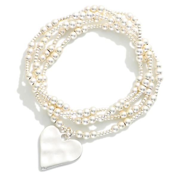 Set Of Four Metal Tone Beaded Stretch Bracelets Featuring Hammered Metal Heart Charm 

- Approximately 2.5" D