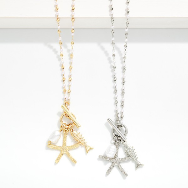 Linked Metal Bead & Pearl Necklace Featuring Metal Tone Starfish & Fish Pendant 

- Approximately 16" L