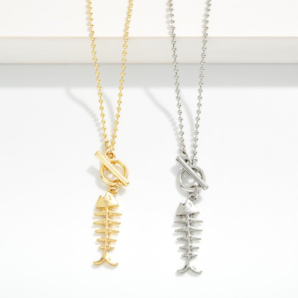 Ball & Chain Necklace Featuring Metal Tone Fish Bones & Toggle Clasp Pendant 

- Approximately 16" L