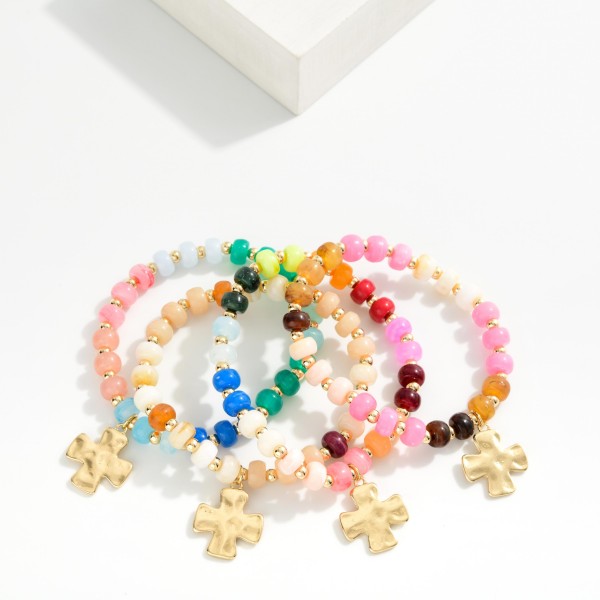 Marbled Acetate Bead Beaded Stretch Bracelet With Hammered Metal Plus Cross Charm

- Approximately 2.5" D