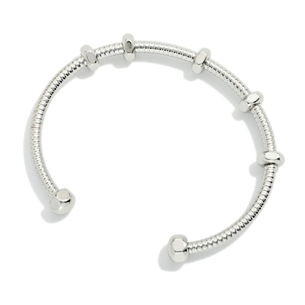 Ribbed Metal Tone Cuff Bracelet With Screw Nut Stations 

- Approximately 2.25" D
