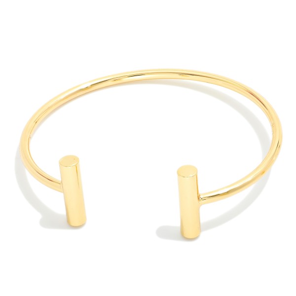 Metal Tone Cuff Bracelet With Metal Bar Edges 

- Approximately 2.5" D 