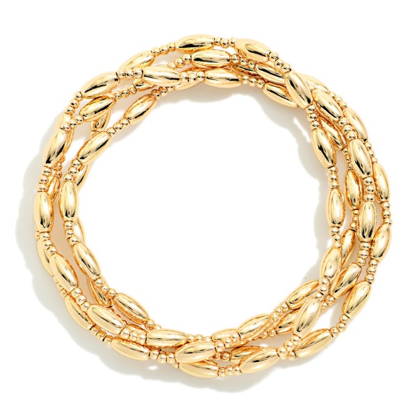 Set Of Four Metal Tone Cylinder Bead Beaded Stretch Bracelets 

- Approximately 2.5" D