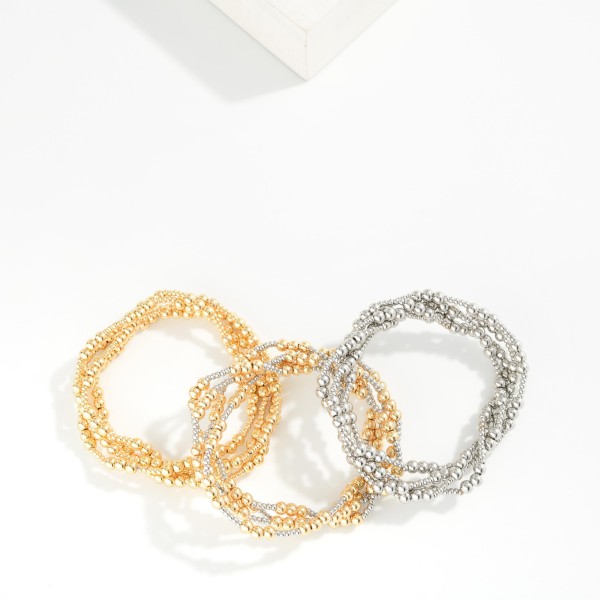 Set Of Four Metal Beaded Stretch bracelets 

- Approximately 2.5" D 