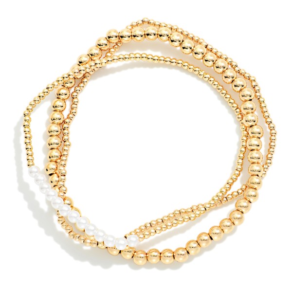 Set Of Three Metal Tone Beaded Stretch Bracelets Featuring Pearl Details 

- Approximately 2.5" D