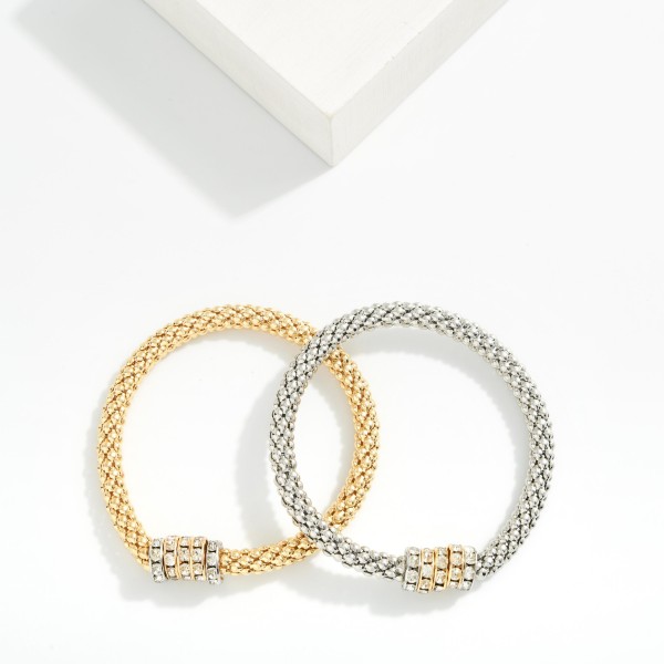Metal Tone Mesh Stretch Bracelet Featuring Beaded Rhinestone Disks

- Approximately 2.5" D