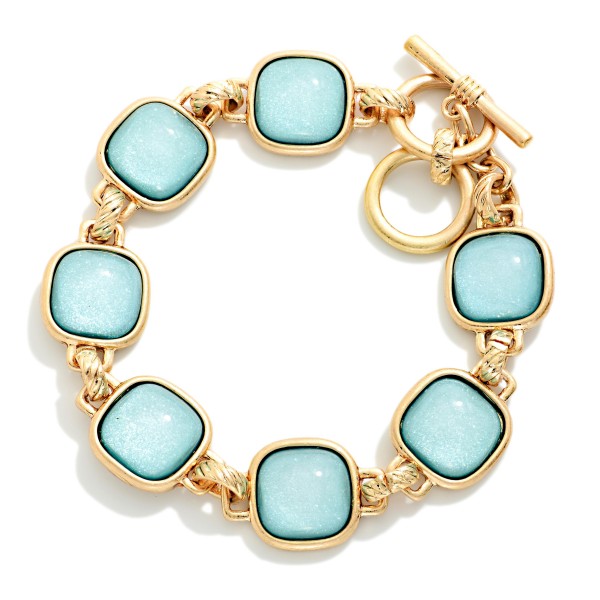 Metal Tone Bracelet Featuring Glitter Resin Squared Stations With Toggle Clasp  

- Approximately 3.5