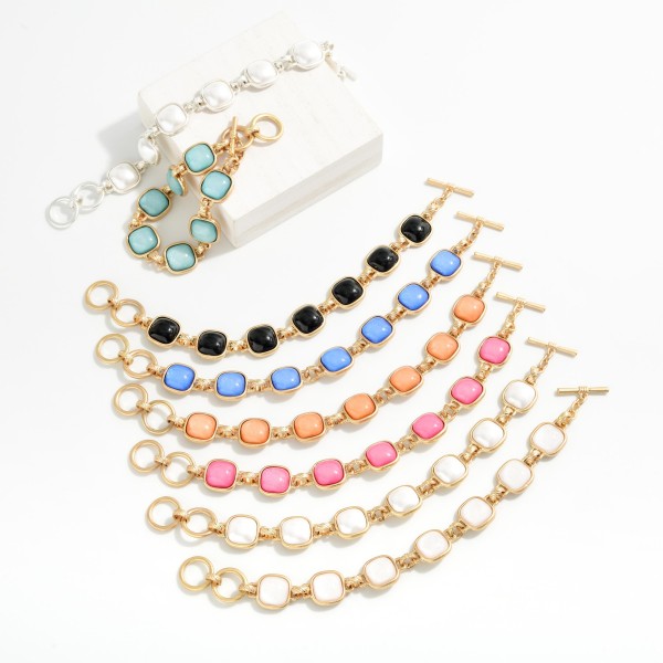 Metal Tone Bracelet Featuring Glitter Resin Squared Stations With Toggle Clasp  

- Approximately 3.5