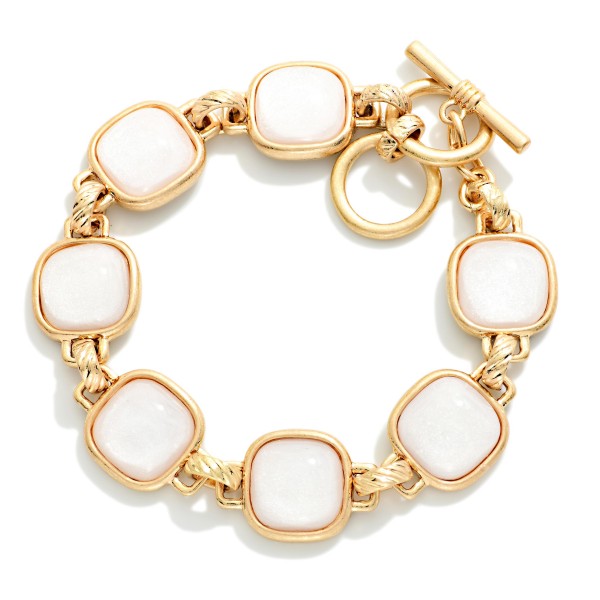 Metal Tone Bracelet Featuring Glitter Resin Squared Stations With Toggle Clasp  

- Approximately 3.5