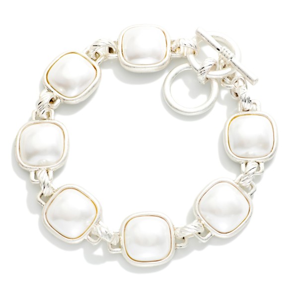 Metal Tone Bracelet Featuring Glitter Resin Squared Stations With Toggle Clasp  

- Approximately 3.5