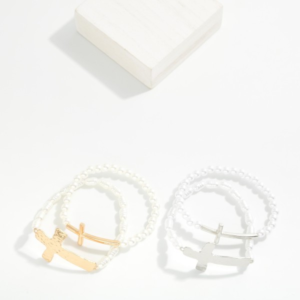 Set Of Two Pearl Beaded Stretch Bracelets Featuring Metal Tone East West Crosses 

- Approximately 2.5" D