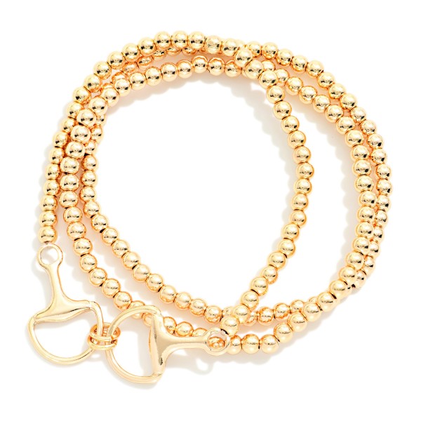 Set Of Three Metal Tone Beaded Stretch Bracelet Featuring Horsebit Charm 