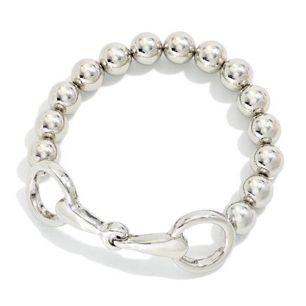 Metal Tone Beaded Stretch Bracelet Featuring Horsebit Detail 

- Approximately 2.75" D