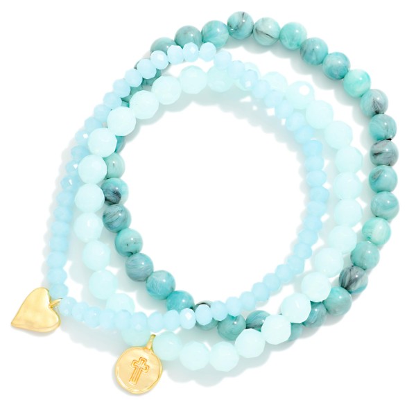 Set Of Three Beaded Stretch Bracelets Featuring Faceted & Stone Beads With Hammered Metal Heart & Cross Charms 

- Approximately 2.75" D