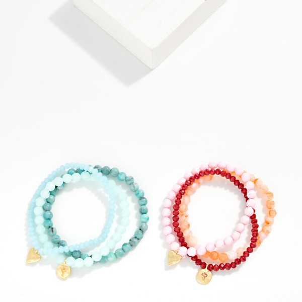 Set Of Three Beaded Stretch Bracelets Featuring Faceted & Stone Beads With Hammered Metal Heart & Cross Charms 

- Approximately 2.75" D