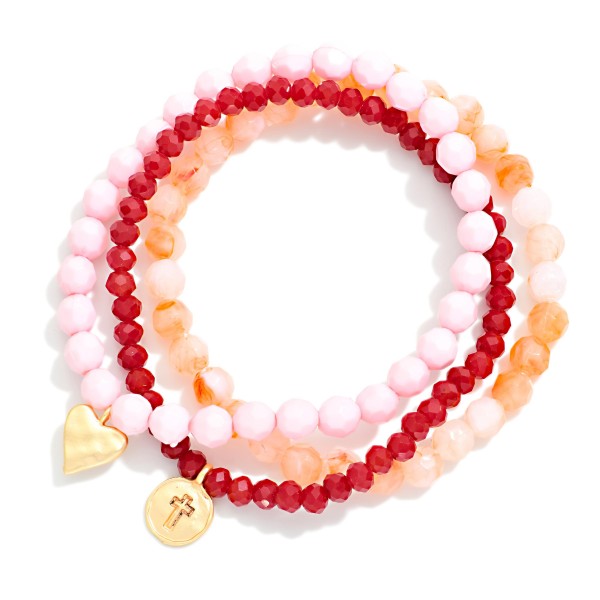 Set Of Three Beaded Stretch Bracelets Featuring Faceted & Stone Beads With Hammered Metal Heart & Cross Charms 

- Approximately 2.75" D