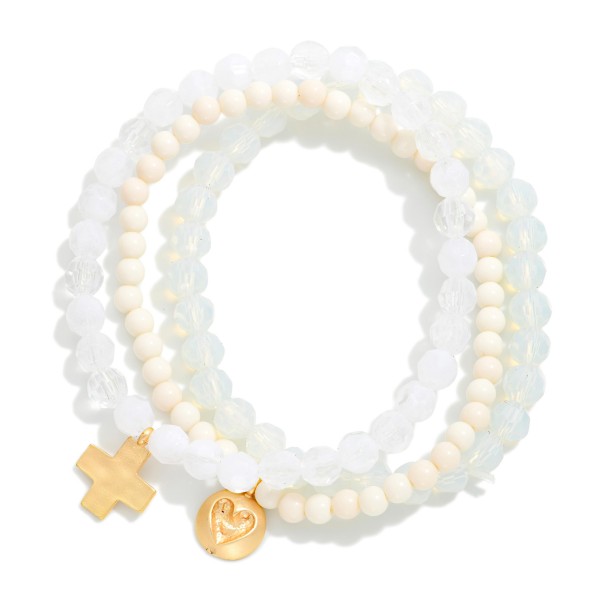 Set Of Three Beaded Stretch Bracelets Featuring Faceted & Stone Beads With Hammered Metal Heart & Cross Charms 

- Approximately 2.75" D