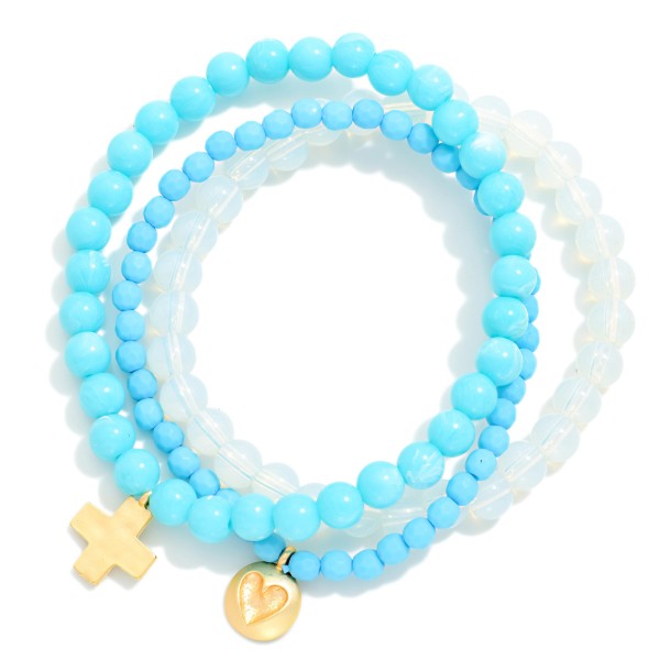 Set Of Three Beaded Stretch Bracelets Featuring Faceted & Stone Beads With Hammered Metal Heart & Cross Charms 

- Approximately 2.75" D