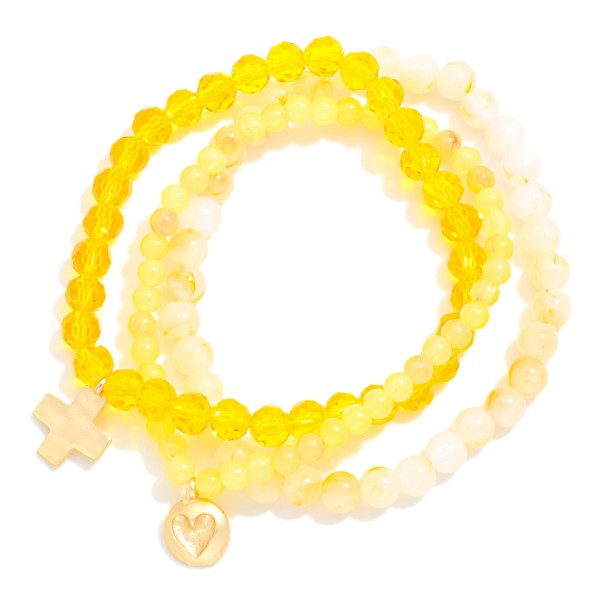 Set Of Three Beaded Stretch Bracelets Featuring Faceted & Stone Beads With Hammered Metal Heart & Cross Charms 

- Approximately 2.75" D
