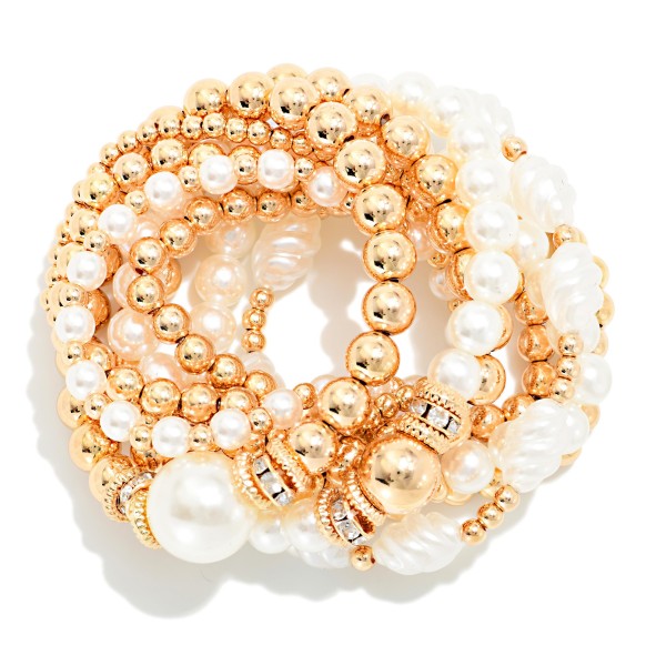 Set Of Nine Mixed Beaded Stretch Bracelets Featuring Gold Tones, Pearls, And Rhinestones

Approximately 2.5" D