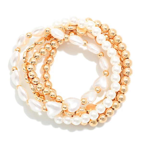 Set Of Five Flat Beads, Pearl Beads, And Gold Tone Beaded Stretch Bracelets Featuring Hearts

Approximately 2.5" D 