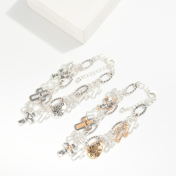 Twisted Link Chain Link Bracelet Featuring Metal Tone Engraved Cross Charms 

- Approximately 3" D
- Extender 1" L 