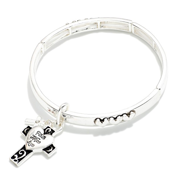 Metal Tone Bangle Stretch Bracelet With Hearts Featuring Cross & Heart Charm

- Approximately 2.5" D