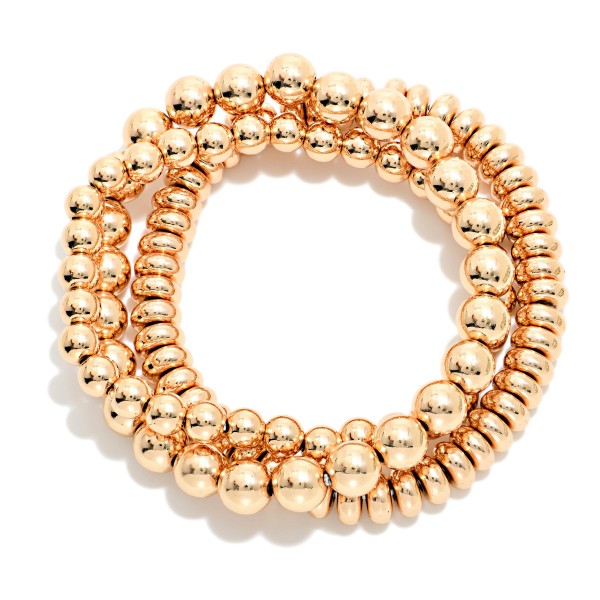 Set Of Three Metal Tone Stretch Bracelets Featuring Disk Beads

- Approximately 2.5" D