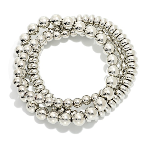 Set Of Three Metal Tone Stretch Bracelets Featuring Disk Beads

- Approximately 2.5" D