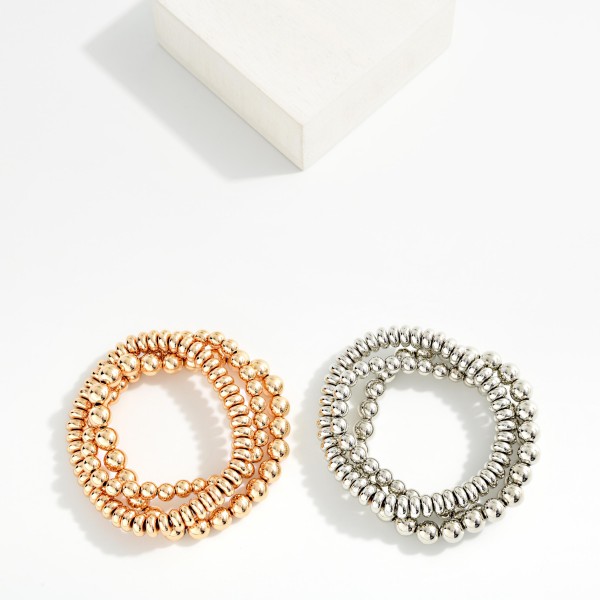 Set Of Three Metal Tone Stretch Bracelets Featuring Disk Beads

- Approximately 2.5" D