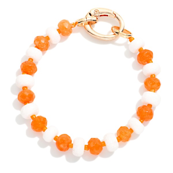 Game Day Faceted Bead Stretch Bracelet With Metal Tone Oval Clasp 

- Approximately 2.5" D