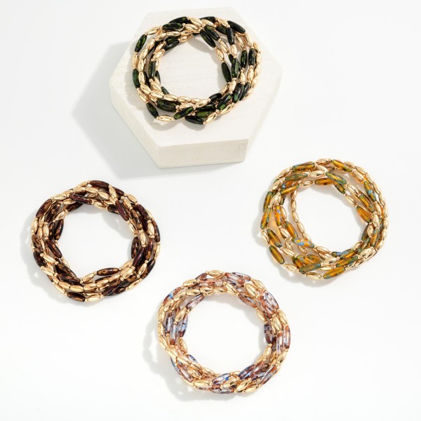 Set Of Six Metal Tone & Speckled Acrylic Long Oval Beaded Bracelets 

-Approximately 2.5" D