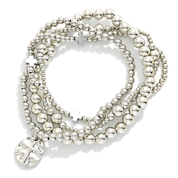 Set Of Four Metal Tone Beaded Stretch Bracelets Featuring Plus Crosses & Cross Charm

- Approximately 2.5" D 