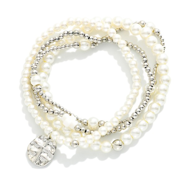 Set Of Four Metal Tone & Pearl Beaded Stretch Bracelets Featuring Hammered Metal Cross Medallion

- Approximately 2.5" D