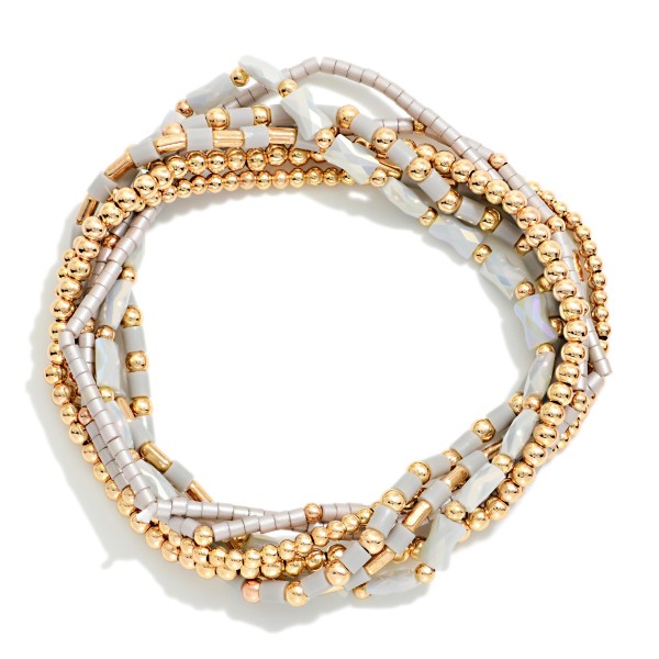 Set Of 7 Petite Bead Beaded Stretch Bracelets Featuring Metal Tones, Heishi Beads, & Cylinder Beads 

- Approximately 2.5" D
