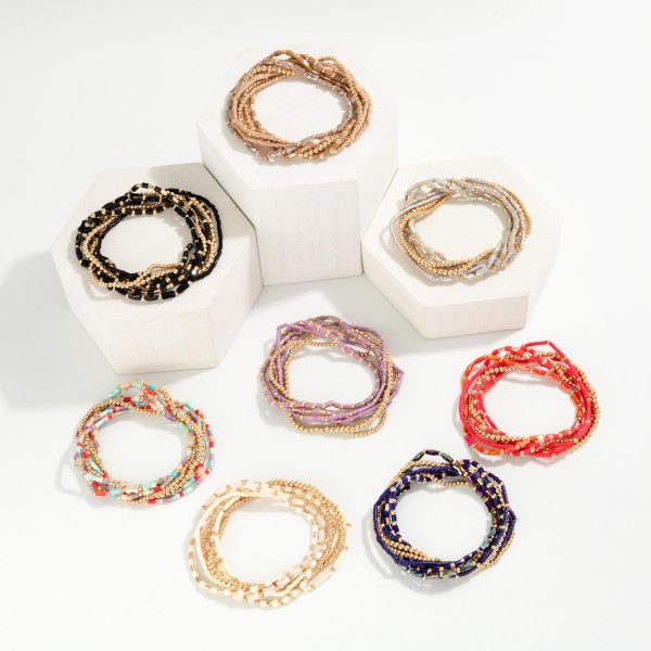 Set Of 7 Petite Bead Beaded Stretch Bracelets Featuring Metal Tones, Heishi Beads, & Cylinder Beads 

- Approximately 2.5" D