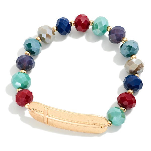 Faceted Bead Beaded Stretch Bracelet Featuring Metal Tone East West Cross

- Approximately 2.5" D