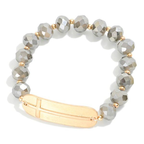 Faceted Bead Beaded Stretch Bracelet Featuring Metal Tone East West Cross

- Approximately 2.5" D