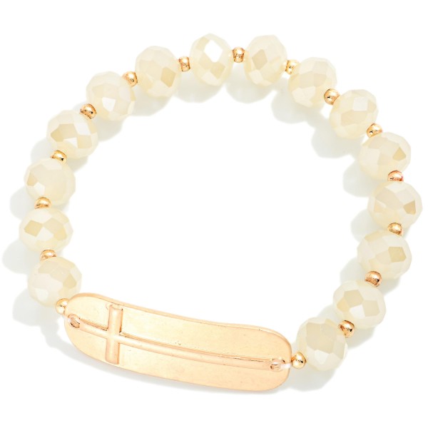 Faceted Bead Beaded Stretch Bracelet Featuring Metal Tone East West Cross

- Approximately 2.5" D