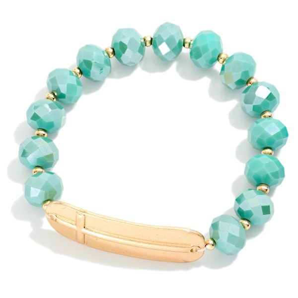 Faceted Bead Beaded Stretch Bracelet Featuring Metal Tone East West Cross

- Approximately 2.5" D