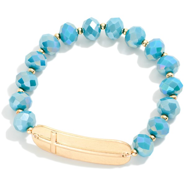 Faceted Bead Beaded Stretch Bracelet Featuring Metal Tone East West Cross

- Approximately 2.5" D