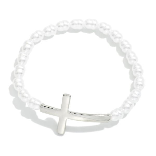 Baroque Beaded Stretch Bracelet Featuring Metal Tone East West Cross

- Approximately 2.5" D