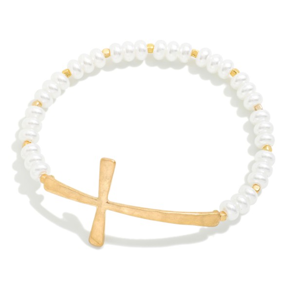 Pearl Beaded Stretch Bracelet Featuring Hammered Metal East West Cross

- Approximately 2.5" D