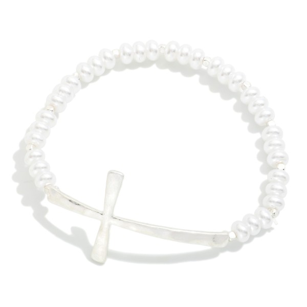 Pearl Beaded Stretch Bracelet Featuring Hammered Metal East West Cross

- Approximately 2.5" D