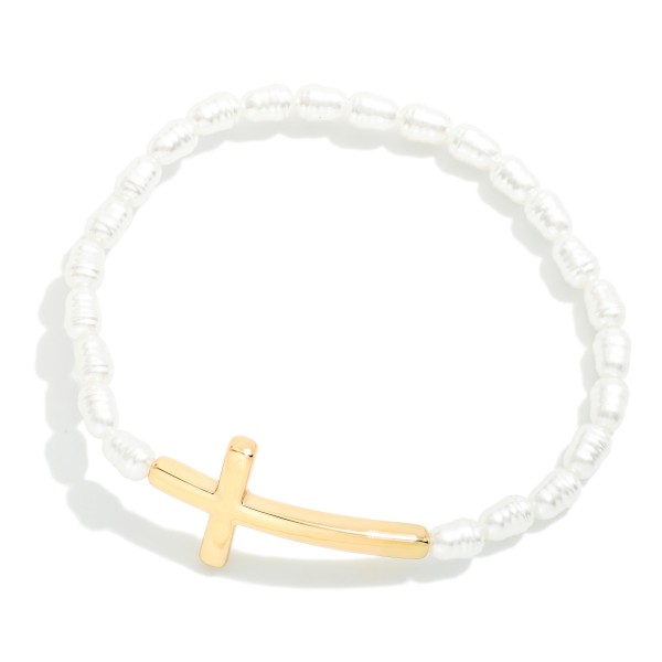 Ringed Pearl Beaded Stretch Bracelet Featuring Metal Tone East West Cross

- Approximately 2.5" D