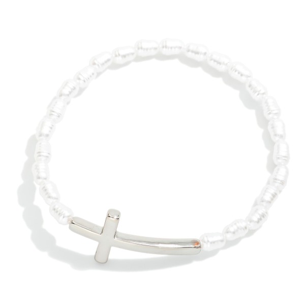 Ringed Pearl Beaded Stretch Bracelet Featuring Metal Tone East West Cross

- Approximately 2.5" D