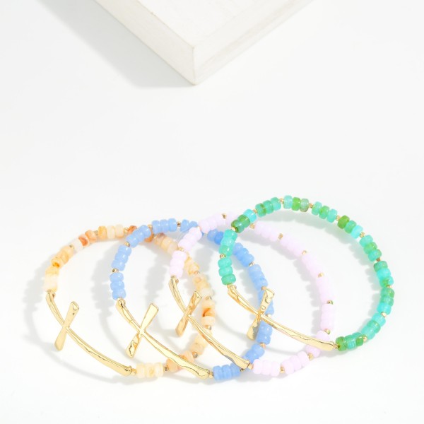 Petite Acetate Bead Beaded Stretch Bracelet Featuring Metal Tone East West Cross

- Approximately 2.5" D