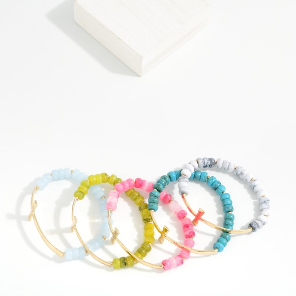Marbled Acetate Bead Beaded Stretch Bracelet Featuring Metal Tone East West Cross

- Approximately 2.5" D