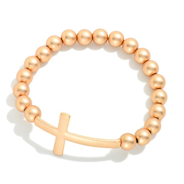 Matte Metal Beaded Stretch Bracelet Featuring East West Cross

- Approximately 3" D