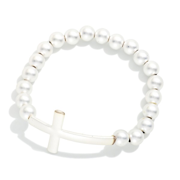 Matte Metal Beaded Stretch Bracelet Featuring East West Cross

- Approximately 3" D